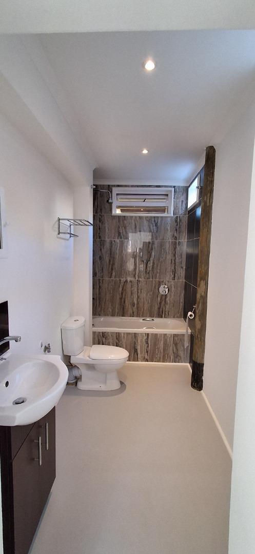 763502_Bathroom_with_shower_in_bath.jpg